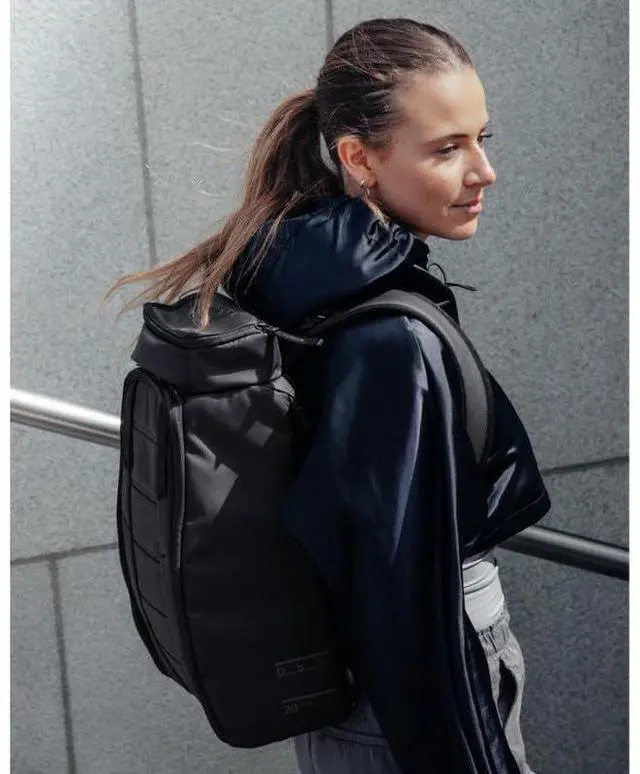 Alt view image 3 of 5 - Db Journey The Hugger Backpack - Durable Travel Backpack with Laptop Compartment & Pockets for Work, Luggage Backpack with Roller Bag Hook Up System, 20L - Blackout