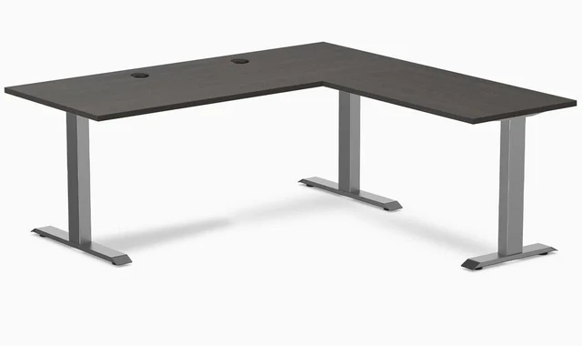 Main image of Desky Zero Laminate L-Shape Office Desk - Burnished Wood / 70.9 x 29.5 x 68.9 x 23.6 in with Grommets / Space Gray