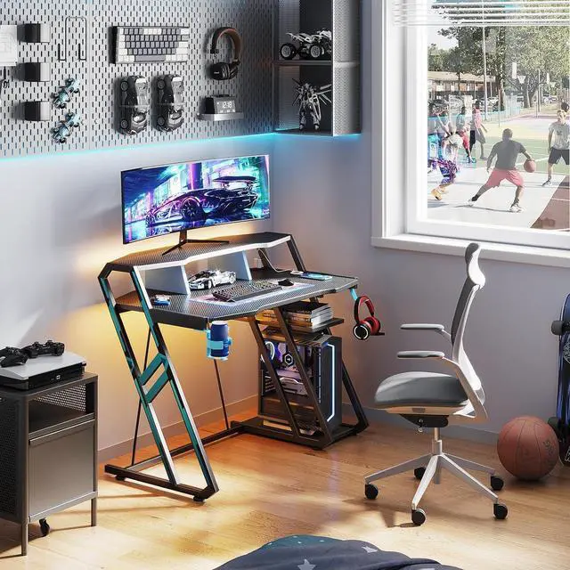 Alt view image 2 of 7 - MOTPK Gaming Desk with Power Outlet & LED Lights, Computer Desk 39inch with PC Storage Shelf, Gaming Table with Carbon Fiber Texture, Gamer Desk, Gift for Boys Men, Black