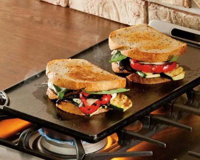 Alt view image 4 of 5 - Reversible Cast Iron Grill/Griddle C 9.5 x 16.75 Inch Pre-Seasoned Cooking Surface C Flat & Ribbed Sides C Use on Stove Grill or Campfire C Made in the USA C Heavy-Duty Black