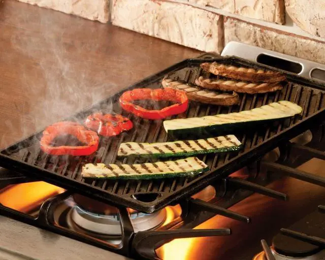 Alt view image 5 of 5 - Reversible Cast Iron Grill/Griddle C 9.5 x 16.75 Inch Pre-Seasoned Cooking Surface C Flat & Ribbed Sides C Use on Stove Grill or Campfire C Made in the USA C Heavy-Duty Black