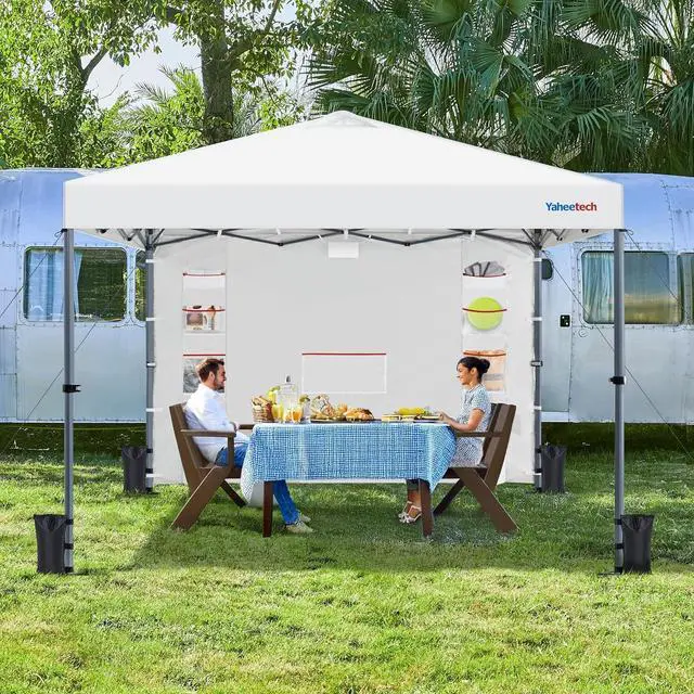 Alt view image 2 of 7 - 10x10 Pop-up Canopy Tent w/Removable Pockets Sidewall for Extra Storage, Outdoor Sun Shelter Waterproof & Durable w/Wheeled Bag, Sandbags & Guylines for Beach Camping Party (White)
