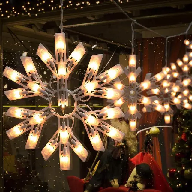 Alt view image 3 of 7 - Snowflake Christmas String Lights - 2 Pack 6 Drops 8.8 Ft. 100 Mini Bulb Snowflake Icicle Lights with Hooks Connectable Hanging Lights for Xmas Rooftop Home Indoor Outdoor Party Wedding