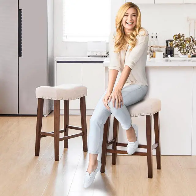 Alt view image 2 of 7 - PrimeZone Counter Height Bar Stools Set of 4 - Backless Saddle Barstools with 4.3" Thick Upholstered, Nailhead Trim Linen Fabric & Solid Wood Legs, 24 Inch Counter Stools for Kitchen Island, Beige