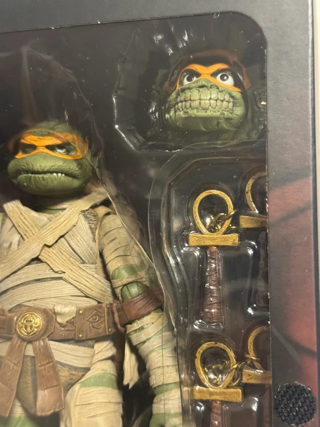 Main image of English:Mummy Turtle Action Figure, Universal Monster Crossover Collectible, 7 Inch Posable Figure, Full Accessories, Sealed In Box