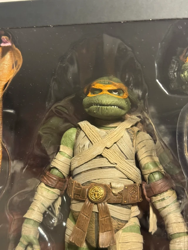 Alt view image 3 of 6 - English:Mummy Turtle Action Figure, Universal Monster Crossover Collectible, 7 Inch Posable Figure, Full Accessories, Sealed In Box