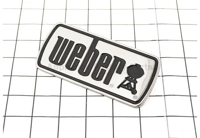 Main image of Weber 66513 LOGO PLATE SS BLK FILL GENESIS 2017 BB