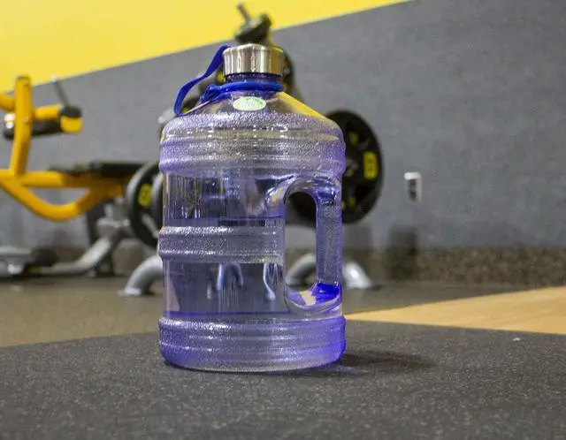 Alt view image 5 of 6 - New Wave Enviro Iconic 1 Gallon Round BPA Free Water Bottle with Stainless Steel Cap and Integrated Handle, Ideal for Gym and Outdoor Life, Blue