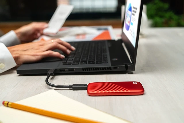 Alt view image 2 of 5 - Western Digital 2TB My Passport SSD Portable External Solid State Drive, Red, Sturdy and Blazing Fast, Password Protection with Hardware Encryption - WDBAGF0020BRD-WESN