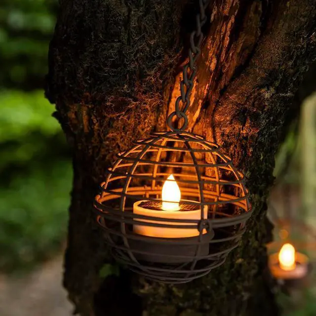 Alt view image 2 of 7 - Solar Hanging Lanterns Outdoor Waterproof, Rust Iron Ball Candle Holder with Flickering Solar Powered Tea Lights, Perfect Chargeable Solar Lights for Backyard Patio Garden Fence Tree Decoration-4Pack