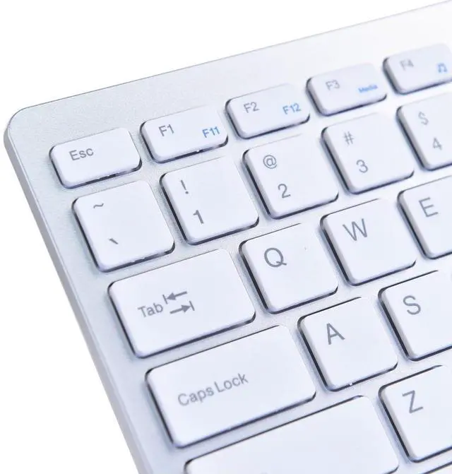 Alt view image 4 of 6 - Ultra Thin Mini USB Wired Compact Keyboard for PC Mac Laptop 78 Key Silver White