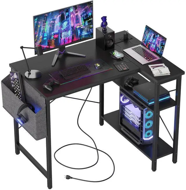 Main image of Small L Shaped Computer Gaming Corner Desk with Power Outlets, Reversible Shelves for Study, Writing Table for Home, Office, Bedroom, Living Room, 40 inches, Black