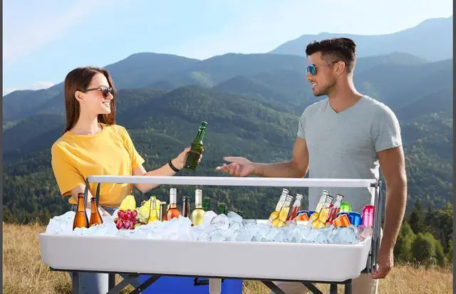 Alt view image 2 of 6 - 4 ft Folding Ice Cooler Table, Party Cooler, Grazing Table, Tables with Drain, Bar Cooler Tables, with Matching Skirt, Storage Shelf (White)