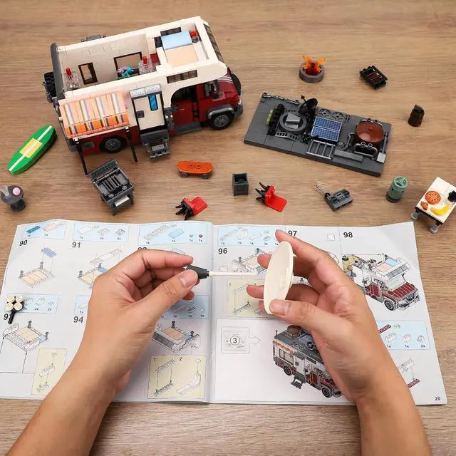 Alt view image 6 of 6 - Camper Van Building Set with LED Lights, Camping RV Model, 924pc | Detachable camper has LED light, customizable interior, campfire, grill, table and chairs for detailed camping scenes.
