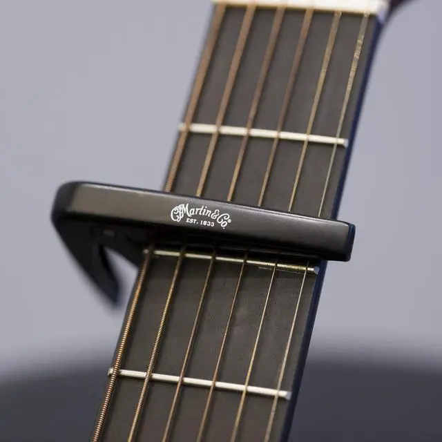 Alt view image 3 of 6 - Starter Pack Guitar Accessories Bundle | Capo, Clip-On Tuner, Pickholder Strap, and Multi-Color Pick Set | Essential Starter Kit for Guitar Players