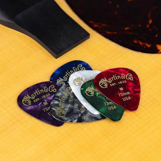 Alt view image 5 of 6 - Starter Pack Guitar Accessories Bundle | Capo, Clip-On Tuner, Pickholder Strap, and Multi-Color Pick Set | Essential Starter Kit for Guitar Players