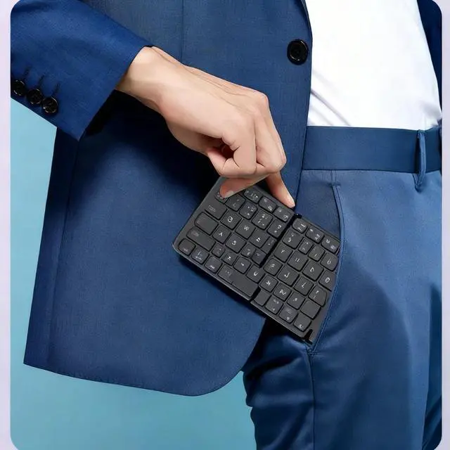 Alt view image 2 of 6 - New Portable Bluetooth Keyboard with Large Touchpad and Foldable Design Compatible with Ipad and Multi-OS Systems (Ideal for Office ) Grey