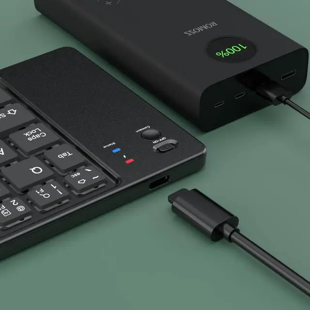 Alt view image 2 of 2 - New ultra-slim, foldable Bluetooth keyboard; rechargeable and compatible with smartphones, Ipad, and laptops Black