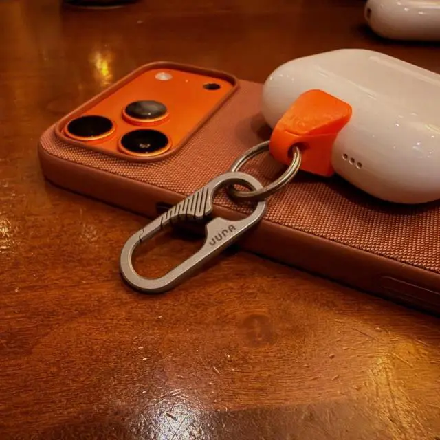 Alt view image 2 of 5 - Jura Anchor for All Apple AirPods Titanium Carabiner Clip - Vibrant Orange Anchor AirPods Pro 3, Pro 2, AirPods 4 & Every Generation Keychain Lanyard Attachment Lightning & USB-C Include