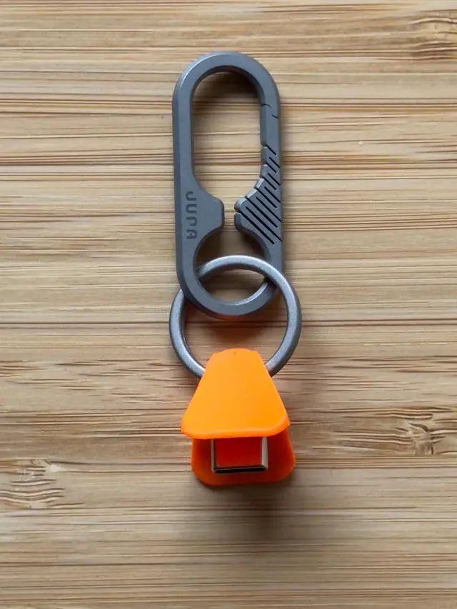 Alt view image 4 of 5 - Jura Anchor for All Apple AirPods Titanium Carabiner Clip - Vibrant Orange Anchor AirPods Pro 3, Pro 2, AirPods 4 & Every Generation Keychain Lanyard Attachment Lightning & USB-C Include