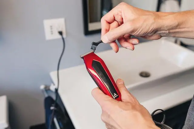 Alt view image 4 of 7 - 562940 Ultra Clip Corded Clipper & Trimmer 15-PieceHair Cutting Combo Kit, Stainless Steel Blades, Power Pivot Motor, Whisper Quiet, Hanger Loop, Red