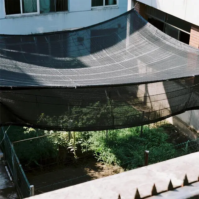 Alt view image 3 of 7 - winemana 20x48 FT Black Shade Cloth, 70% UV Resistant Mesh Tarp with Reinforced Grommets, Breathable Sun Shade Net for Garden, Greenhouse, Patio Plants and Animal Coop Cover