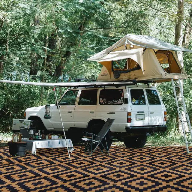 Alt view image 5 of 7 - SAND MINE Reversible Mats, Plastic Straw Rug, Modern Area Rug, Large Floor Mat and Rug for Outdoors, RV, Patio, Backyard, Deck, Picnic, Beach, Trailer, Camping, Black & Brown, 9' x 18'