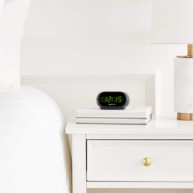 Alt view image 6 of 7 - Amazon Basics Small Digital Oval Alarm Clock with LED Display, Nightlight, Snooze Function and Battery Backup, Black, 4.5 x 3.5 x 2.4Inches