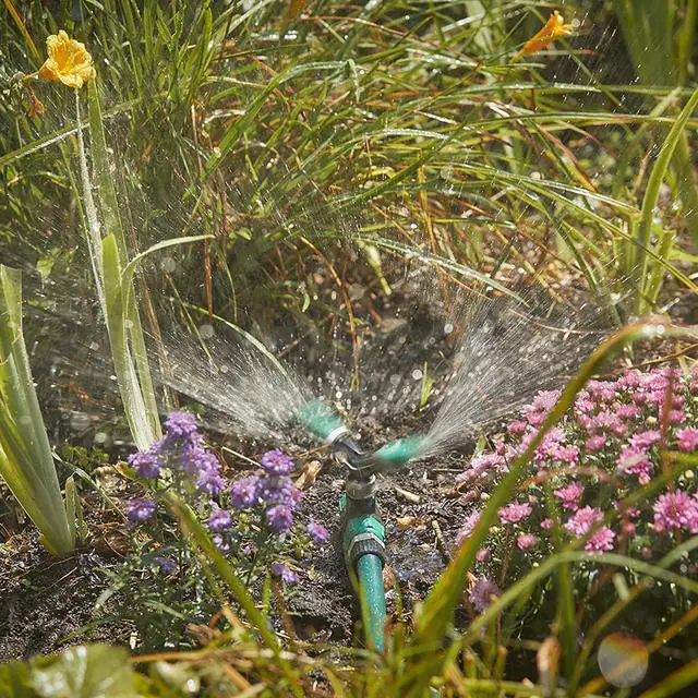 Alt view image 4 of 5 - Adjustable Spinning Sprinkler with Spike Base, Whirling Sprinkler Head for 360 Degree Coverage in Flower Beds and Vegetable Gardens