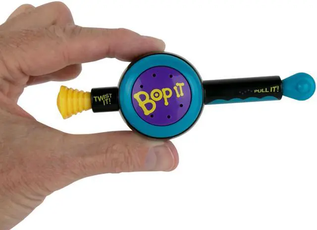Main image of Bop It! The Classic Game of Bop It, Twist It, Pull It in Miniature Size. Travel Electronic Game. Play Solo or with Multiple Players