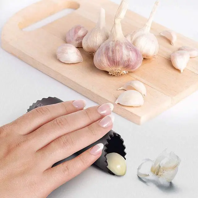 Alt view image 3 of 7 - Garlic Press Rocker Stainless Steel Ginger Crusher Squeezer Kitchen Gadget with Ergonomic handle, Silicone Tube Garlic Peeler and Cleaning Brush Tool Set