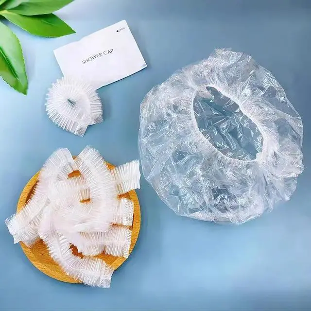 Alt view image 2 of 7 - 200PCS Disposable Shower Caps, Plastic Clear Hair Cap Large Thick Waterproof Bath Caps for Women & Men Unisex Reusable Travel Essentials for Deep Conditioning, Hair Treatment, Hotel, Spa, and Home Use
