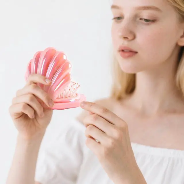 Alt view image 2 of 7 - Iridescent Shell Folding Hair Brush with Mirror, Compact Travel Size Mermaid Hair Brush for Purse, Portable Brush Mini Pocket Mirror Massage Comb for Women (PINK)