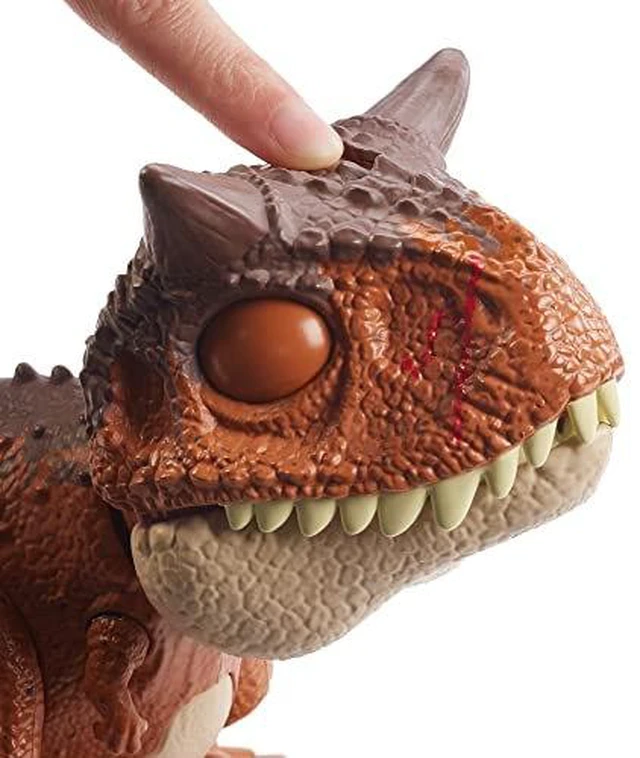 Alt view image 5 of 7 - Jurassic World Toys Chompin Carnotaurus Toro Dinosaur Action Figure Camp Cretaceous with Button-Activated Chomping & Other Motions, Realistic Sculpting, Kid Gift Age 4 Years & Up, Multi