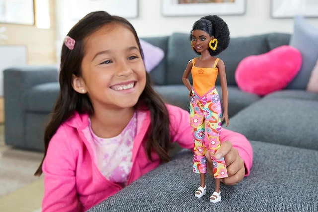 Alt view image 2 of 6 - Barbie Fashionistas Doll #198, Petite with Curly Black Hair, Retro Floral Clothes & Accessories Including Sandals & Heart-Shaped Earrings