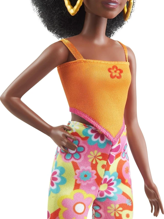 Alt view image 4 of 6 - Barbie Fashionistas Doll #198, Petite with Curly Black Hair, Retro Floral Clothes & Accessories Including Sandals & Heart-Shaped Earrings