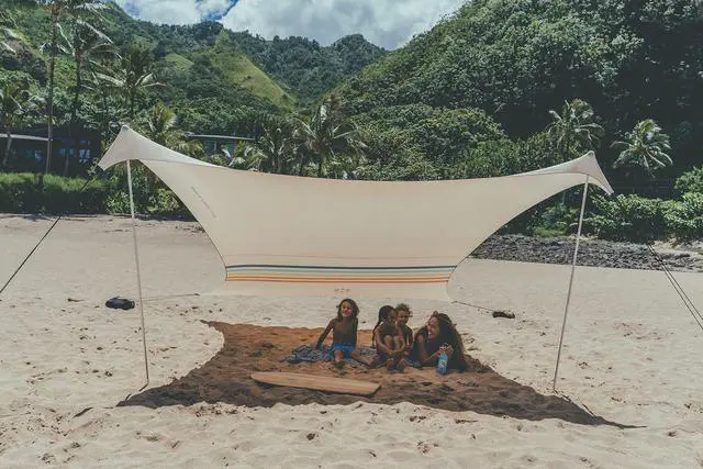 Alt view image 2 of 5 - Portable Beach Tent Sun Shelter with Sand Anchor - Lightweight Beach Shade Canopy - Easy Setup for Family Outings - Patented Reinforced Corners - UPF 50+ Sun Protection - 7 x 7ft - Rainbow