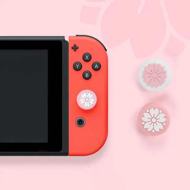 Alt view image 2 of 3 - 4 Pack Sakura Flower Thumb Grip Caps, Soft Silicone Cover Joystick Cap For Switch & Lite