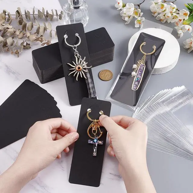 Alt view image 3 of 6 - 100 Sets Long Keychain Display Cards with Self-Sealing Bags, 5.9x2 Inch Black Paper Keyring Display Holder Keychain Cards Holder for Displaying Keyring Keychains Jewelry Packaging