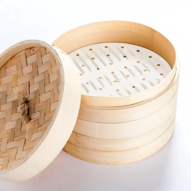 Alt view image 3 of 7 - 100 Pcs Bamboo Steamer Liner - 10" Round Steam Paper With Holes