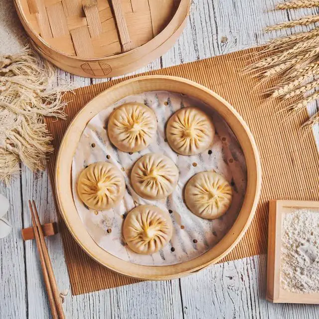 Alt view image 6 of 7 - 100 Pcs Bamboo Steamer Liner - 10" Round Steam Paper With Holes