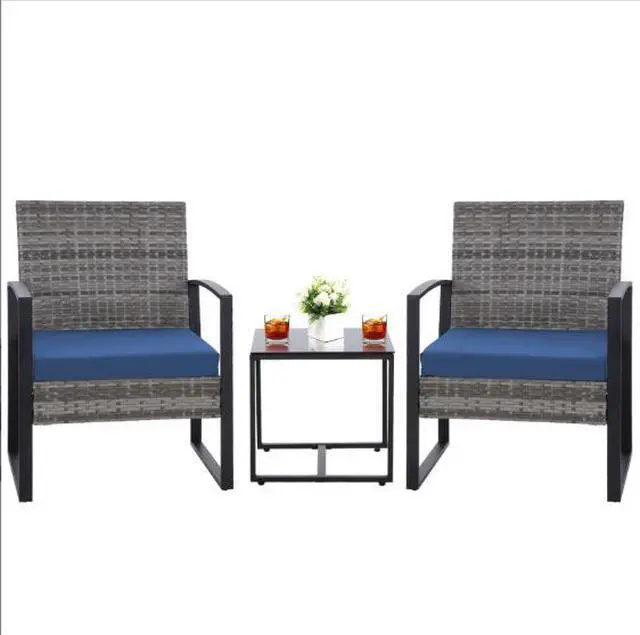 Main image of Wicker chair and coffee table set - three-piece combination for outdoor garden. Woven wicker sofa for outdoor patio and garden terrace. Set of casual tea tables for leisure use in the villa.