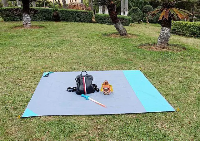 Alt view image 6 of 7 - Ultra Picnic Blanket- Portable Pocket Picnic Sheet for Outdoor Multiple Use,Best Mat for Travel & Festivals, Lightweight Waterproof & Quick Drying with 4 Portable Tent Pegs (Blue)