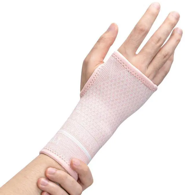 Main image of Copper Wrist Compression Sleeve 1 Pair, Comfortable Hand Brace Support for Arthritis, Tendonitis, Sprains, Workout, Carpal Tunnel - Left & Right - Women and Men (Pink, M)