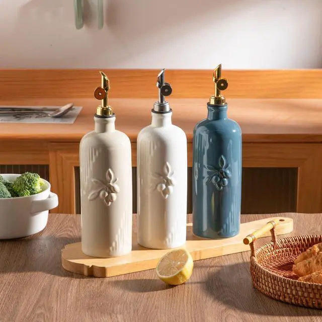 Alt view image 3 of 6 - Ceramic Olive Oil Dispenser Bottle for Kitchen Counter, 20 oz Oil Dispenser with Gold Spout, Avocado Oil Cruet for EVOO, Vinegar, Oil Container for Cooking, Pack of 1 (Beige)