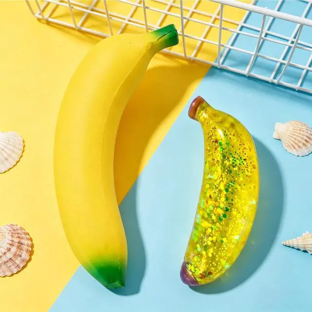 Alt view image 4 of 7 - 2 PCS Banana Squishies, Giant Banana Squishies with Sparkle Glitter, Stress Relief Sensory Tool for Office Desk, Including Jumbo Bananas Stress Ball and Sparkle Bananas Stress Ball, 7'' and 5''