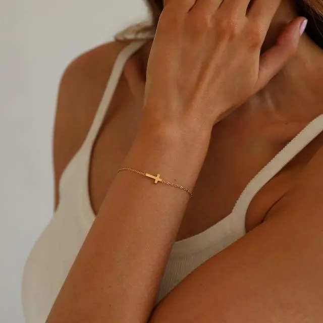 Alt view image 2 of 7 - 18K Gold Plated Tiny Sideways Cross Bracelets for Women Adjustable Simple Gold Thin Religious Charm Bracelet Stainless Steel Dainty Link Chain Bracelet Baptism Jewelry