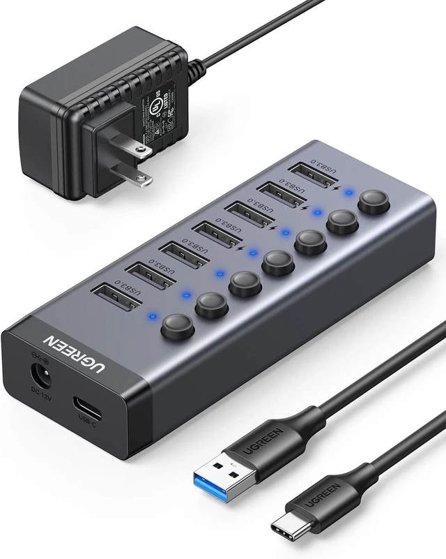 Main image of UGREEN Powered USB Hub 3.0,7 Ports USB Splitter with 4 Smart Charging Ports Aluminum Individual LED Power Switches Extension 12V 2A Charging Adapter for PC Laptop, MacBook Pro Air Mini