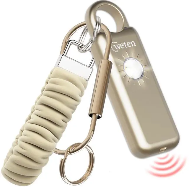 Main image of Personal Safety Alarm Keychain 130dB Siren with Bottom Speaker, LED Light, Wristlet & Carabiner Clip Weatherproof Self Defense Alarm with Low Battery Alert (Gold Satin)
