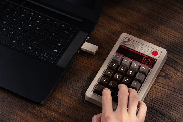 Alt view image 6 of 7 - 8Bitdo Retro 18 Mechanical Numpad for Windows & Android, C64 Edition
Bluetooth, 2.4G and Wired, Calculator Mode, Retro LED Display, Kailh Box White Switches V2